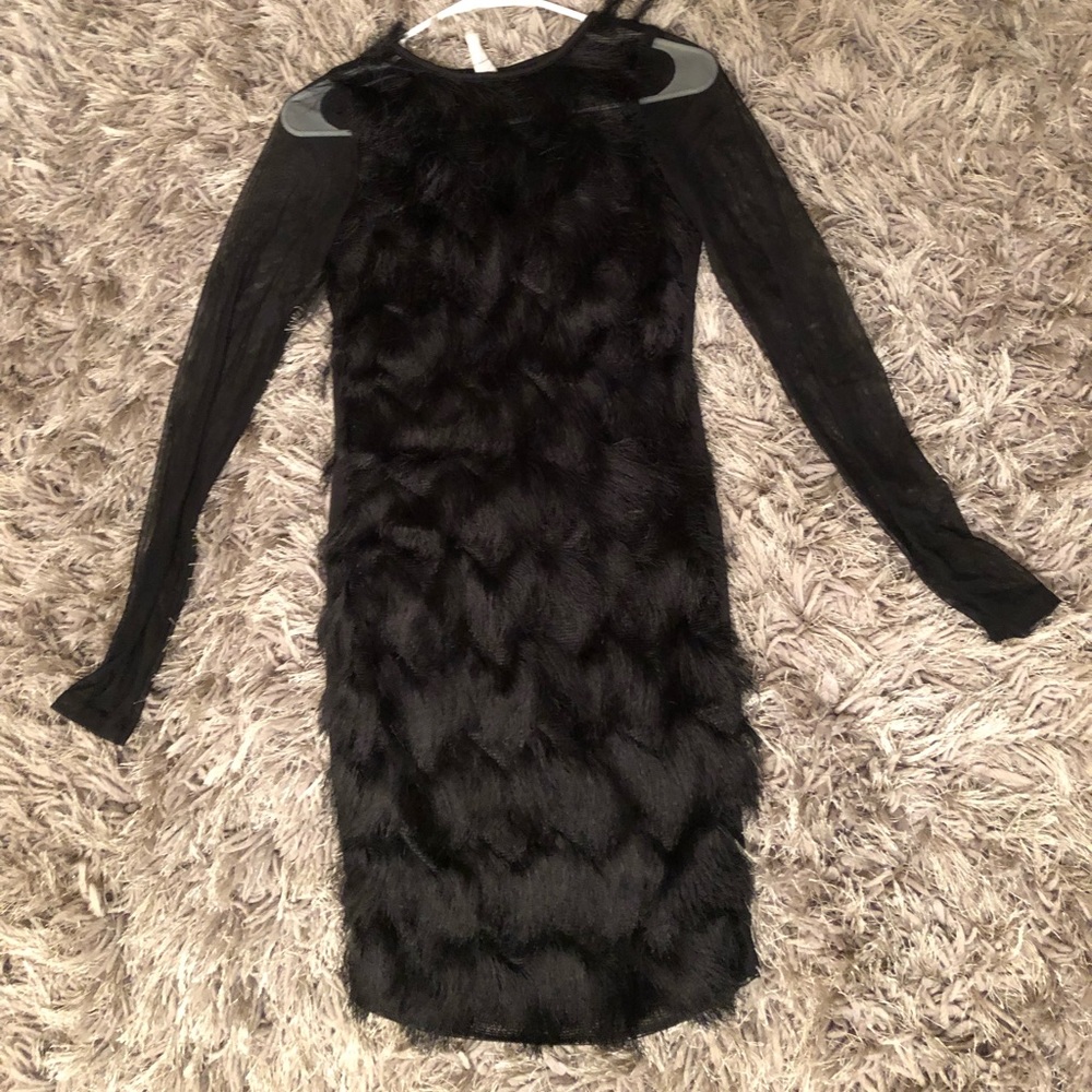 Sexy black dress with fringe detail.